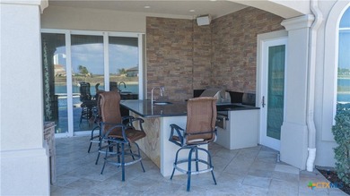 Located on the tranquil shores of the gated community of The - photo 40