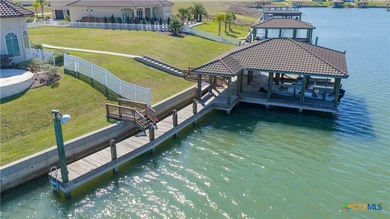 Located on the tranquil shores of the gated community of The - photo 44