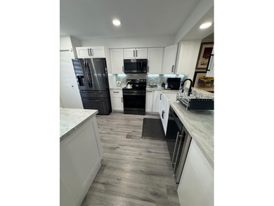 This top-of-the-line designer decorated 2-bedroom-plus-den - photo 3