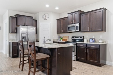 Welcome to this beautifully maintained 4-bedroom, 2-bath home in - photo 7