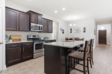 Welcome to this beautifully maintained 4-bedroom, 2-bath home in - photo 8