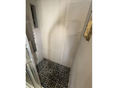 Beautifully renovated 2nd story lake front condominium in a - photo 29