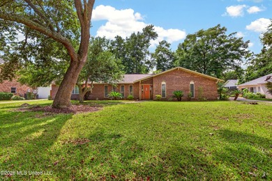 4BR/3BA home situated on a spacious 0.54-acre lot in the - photo 1