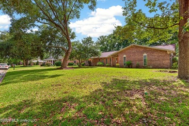 4BR/3BA home situated on a spacious 0.54-acre lot in the - photo 2