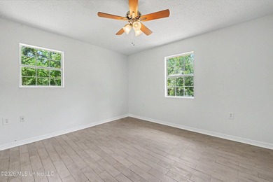 This cozy retreat home is in Bayou La Croix Estates, Bay St - photo 2