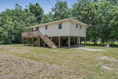 This cozy retreat home is in Bayou La Croix Estates, Bay St - photo 4
