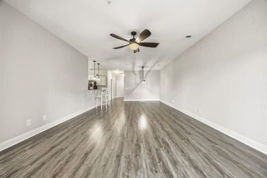 This well-maintained condo in Queens Harbor offers comfort