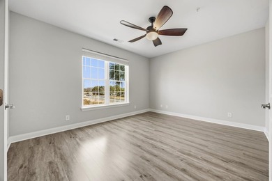 This well-maintained condo in Queens Harbor offers comfort