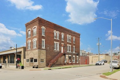 You could be the proud new owner of this three story brick - photo 2