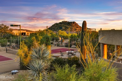 Nestled against a dramatic mountain backdrop and framed by