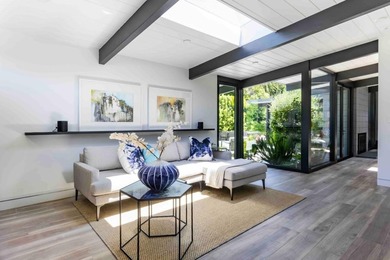 Completely renovated, this exceptional home blends iconic design - photo 9