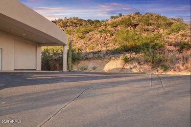 Nestled against a dramatic mountain backdrop and framed by