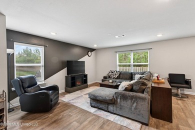 Welcome to this spacious 3-bedroom, 2.5-bath home featuring a - photo 2