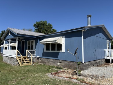 Enjoy a view of the lake right from the covered front porch of
