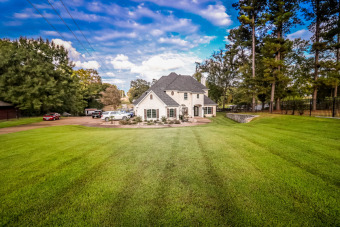 LAKE CHEROKEE SHOWPLACE ON PRIVATE COVE. - Lake Home For Sale in Longview, Texas