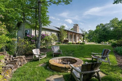 Perched above the pristine waters of Lake Fontana, this - photo 34