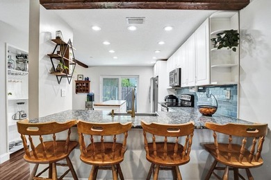 An updated and spacious corner villa in Forest Lake community at - photo 9