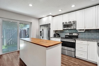 An updated and spacious corner villa in Forest Lake community at - photo 10