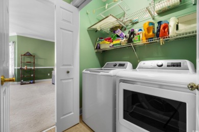 Welcome to refined coastal living in this elegant 3-bedroom