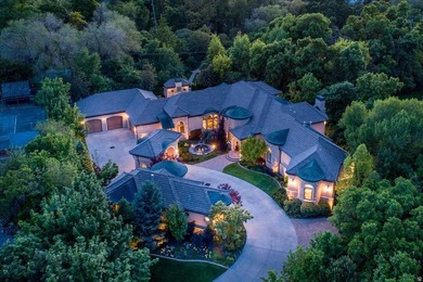 Tucked away on a private, tree-lined lane in Holladay, this - photo 1