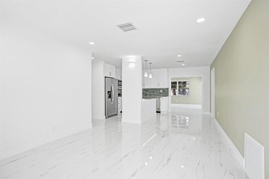 Completely renovated 4-bedroom, 3-bathroom home in desirable - photo 3