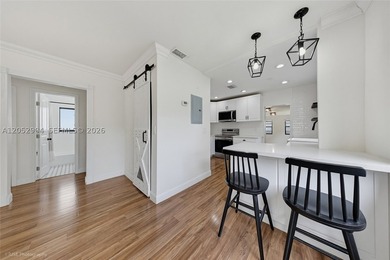 This beautifully maintained 3-bedroom, 2-bath residence offers a - photo 6