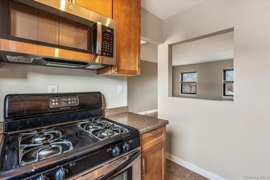 Welcome to this charming top-floor, one-bedroom walk-up located - photo 7