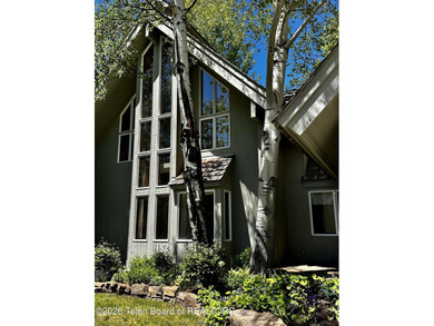 Nestled within Teton Pines, this exceptional Cluster Home offers - photo 2