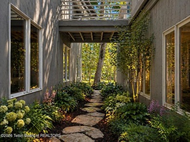 Nestled within Teton Pines, this exceptional Cluster Home offers - photo 3
