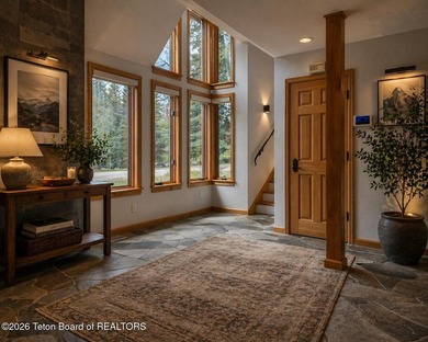 Nestled within Teton Pines, this exceptional Cluster Home offers - photo 4