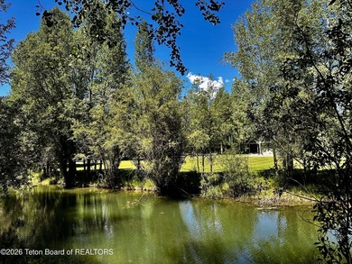 Nestled within Teton Pines, this exceptional Cluster Home offers - photo 9
