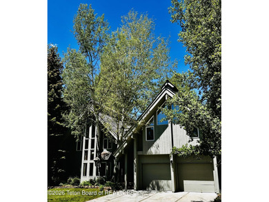 Nestled within Teton Pines, this exceptional Cluster Home offers - photo 10