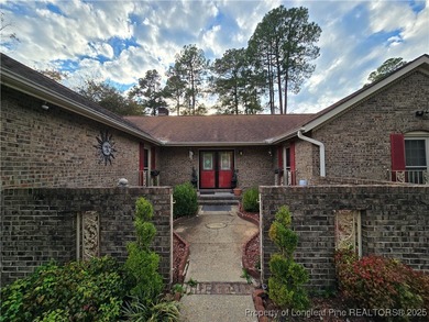 Take a look at this stunning all brick home designed with full