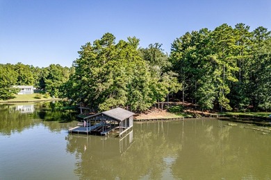 Lakefront Escape with Endless Possibilities. This home is set on - photo 8