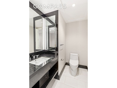 This elegant three-bedroom, three-and-a-half-bath home at One - photo 10