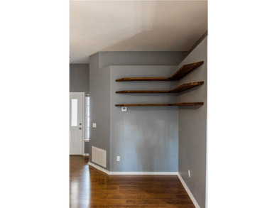 Tucked beneath a mature hardwood canopy in an established - photo 5