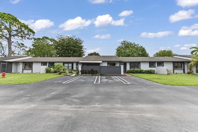 Welcome to 84 Conaskonk Circle in Royal Palm Beach, a bright and - photo 2