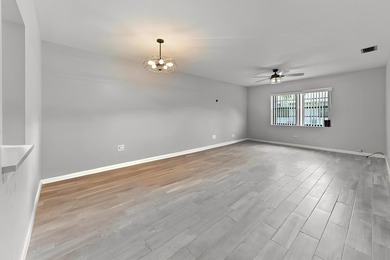 Welcome to 84 Conaskonk Circle in Royal Palm Beach, a bright and - photo 5