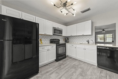 Welcome to 84 Conaskonk Circle in Royal Palm Beach, a bright and - photo 6