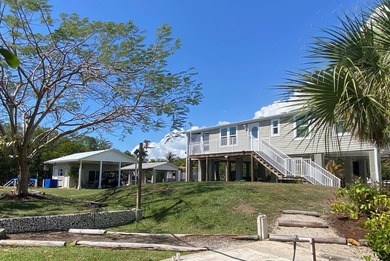 This 2023 stilt home sits on an oversized lot, offering over 250 - photo 3