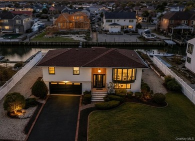 This well-appointed waterfront home blends timeless elegance - photo 1