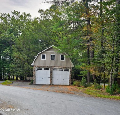Spacious garage; Over sized garage doors lead into a large - Lake Lot For Sale in Tafton, Pennsylvania