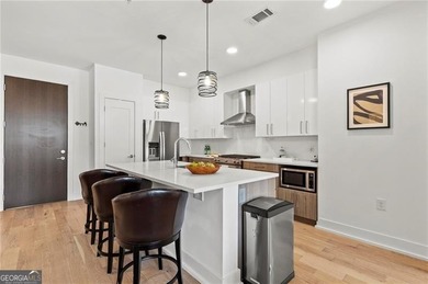 Better than new, this top-floor Midtown residence impresses with