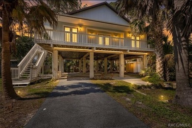 Discover the charm of Old Florida living in this 1994 stilt home - photo 2