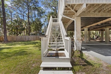 Discover the charm of Old Florida living in this 1994 stilt home - photo 4