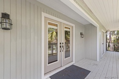 Discover the charm of Old Florida living in this 1994 stilt home - photo 6