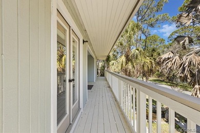 Discover the charm of Old Florida living in this 1994 stilt home - photo 7