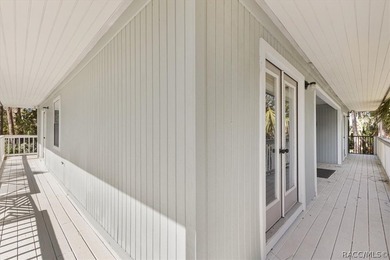 Discover the charm of Old Florida living in this 1994 stilt home - photo 8