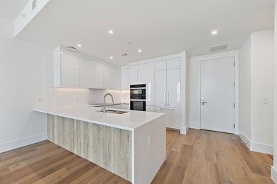 Perched on the 15th floor, this brand-new waterfront residence - photo 13