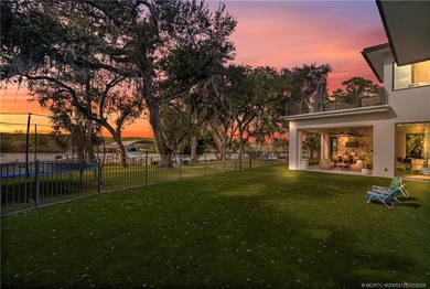 Experience modern waterfront luxury in this stunning - photo 3